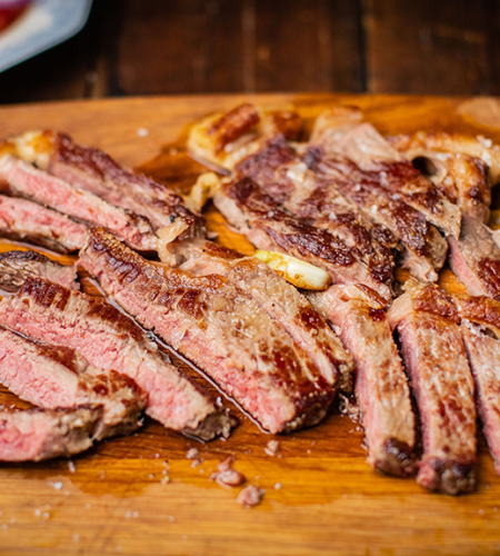 Grass-fed sirloin steak with a simple tomato salad